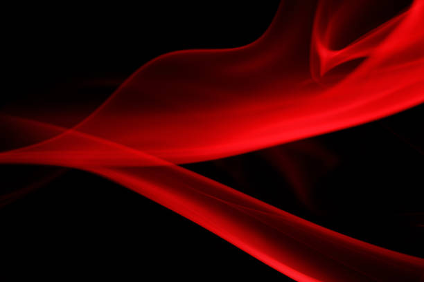 Abstract red smoke moving on black background.