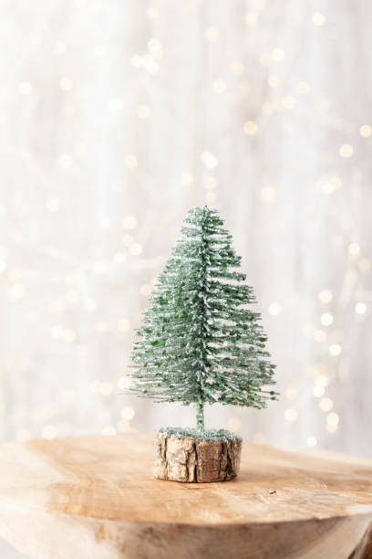 istock Christmas tree on bohek wooden, bokeh background. 1367693074