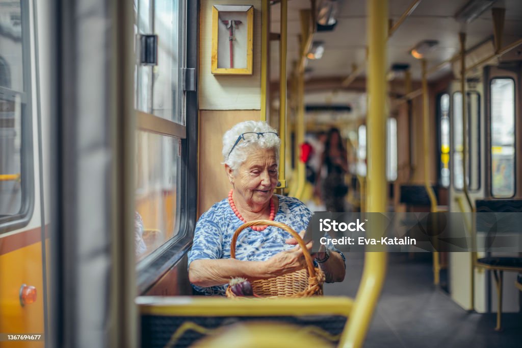 Senior woman in the city Electronic Banking Stock Photo