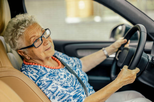 istock Senior woman in the car 1367694695