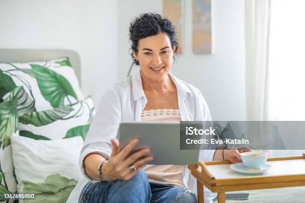 At Home Stock Photo - Download Image Now - Women, One Woman Only, 50-59 Years