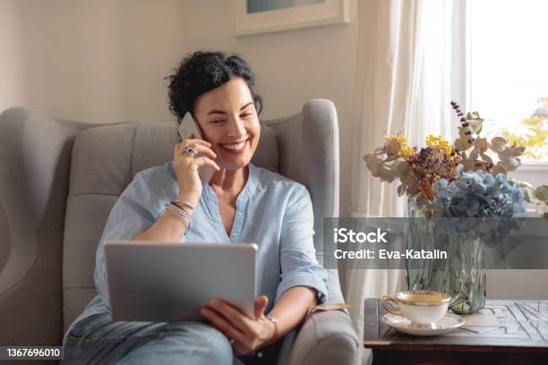 At Home Stock Photo - Download Image Now - Using Phone, Women, One Woman Only