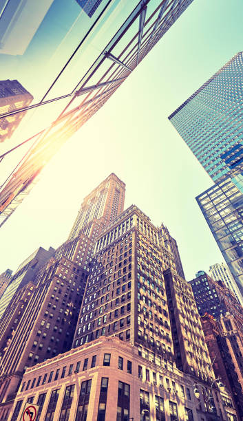 istock Manhattan old and modern buildings against the sun. 1367697326