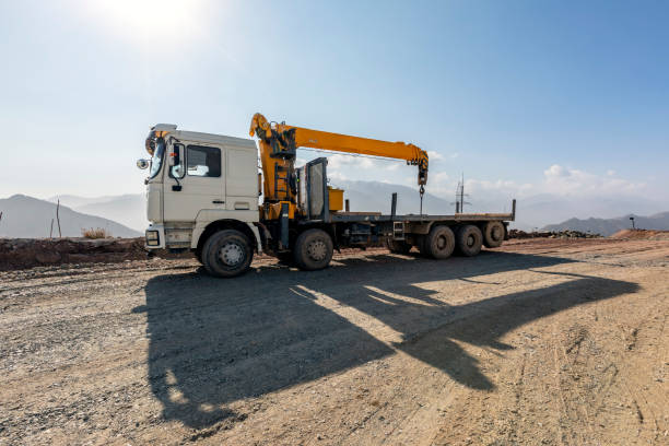 View of the mobile crane with truck (lorry). It is a cable-controlled crane with a telescoping boom mounted on truck-type carriers and as self-propelled. View of the mobile crane with truck (lorry). It is a cable-controlled crane with a telescoping boom mounted on truck-type carriers and as self-propelled. crane truck stock pictures, royalty-free photos & images