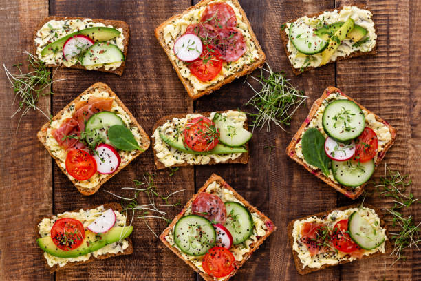 istock Sandwiches with cream cheese, vegetables and salami. 1367698568