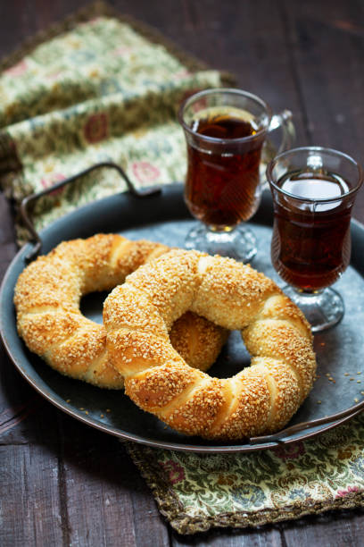 istock Traditional Turkish simits served with tea. Rustic style. 1367698815