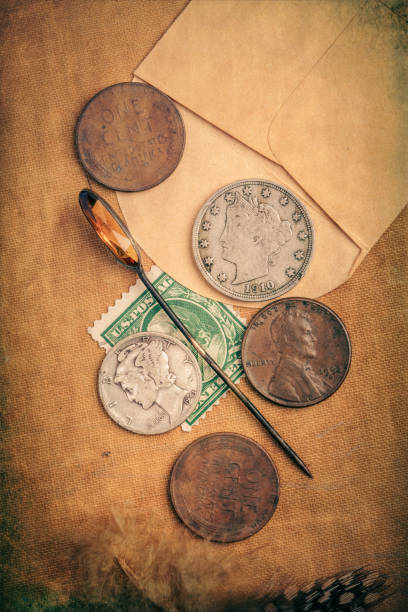 istock Old US Coins Stamp and Hat Pin 1367699429
