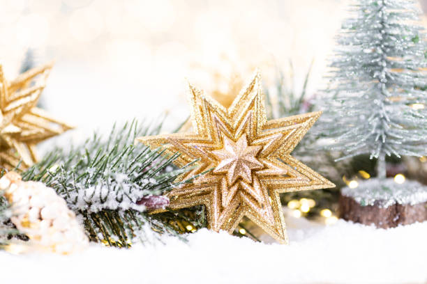 istock Christmas ornament with string lights on blue background. 1367699928