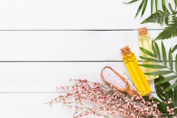 istock Beauty and aromatherapy concept with spa set on pastel rustic wooden background. 1367700029