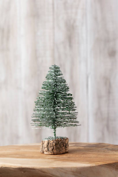 istock Christmas tree on bohek wooden, bokeh background. 1367701434