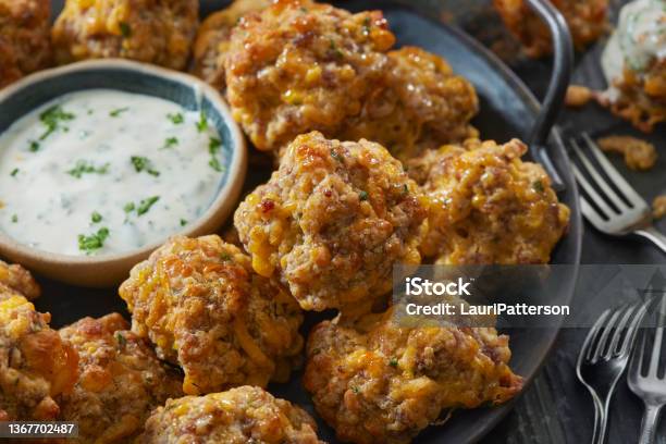 Sausage Biscuit Bites With Cheddar Cheese Stock Photo - Download Image Now - Sausage, Sphere, Meatball