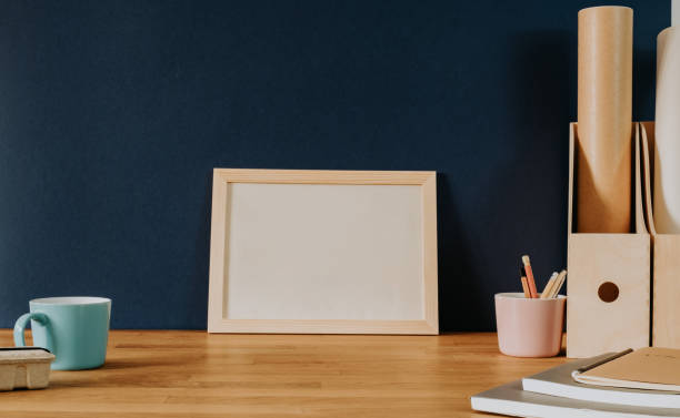 istock Horizontal empty frame on natural wooden desk 1367703795