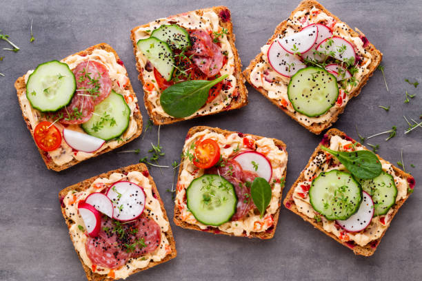 istock Sandwiches with cream cheese, vegetables and salami. 1367703936