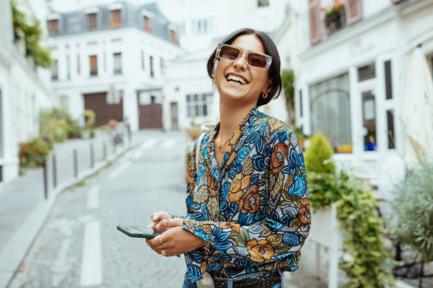 Fashionable millennial woman with sunglasses in city of Paris Young attractive woman visiting Paris paris fashion stock pictures, royalty-free photos & images