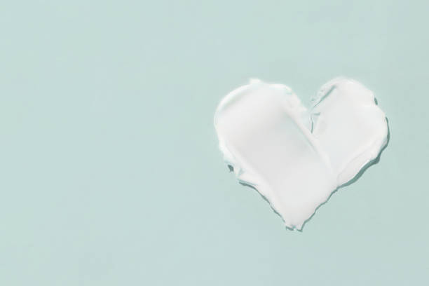 istock A smear of cosmetic cream on a blue background 1367709427