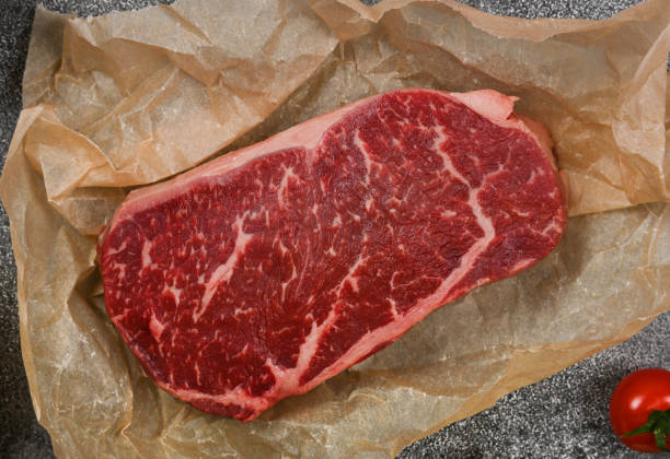 istock Close up raw beef sirloin steak on paper 1367711754