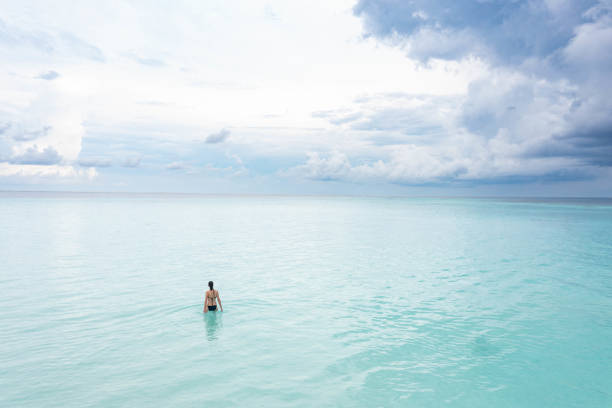 istock Woman enjoying ocean 1367714171