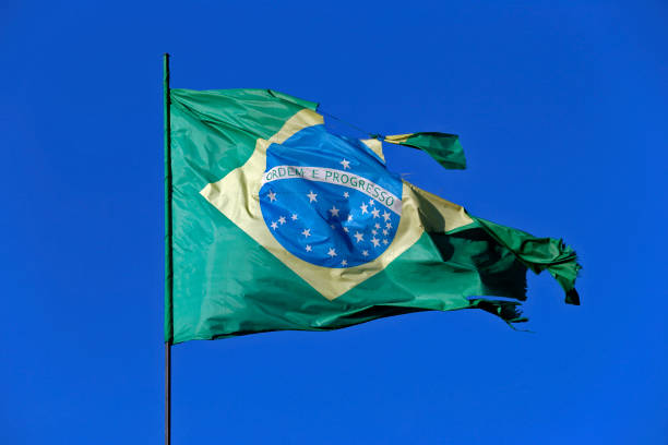 istock Brazilian flag torn in strong wind 1367714291