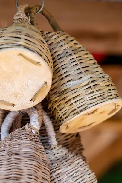 Photo of Closeup of caxixi hanging in handicraft shop