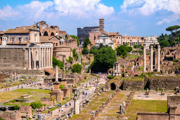 Forum Romanum with Temple of Antoninus and Faustina San Lorenzo in Miranda church and Via Sacra in Rome in Italy Rome, Italy - May 25, 2018: Panorama of Roman Forum Romanum with Temple of Antoninus and Faustina San Lorenzo in Miranda church, Colosseum and Via Sacra in historic center of Rome san lorenzo rome photos stock pictures, royalty-free photos & images