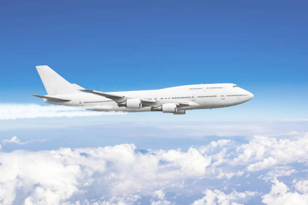 istock Airplane in the sky above the clouds flight journey. 1367722546
