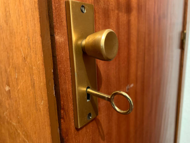 istock Old door with handle and key with hole 1367725602