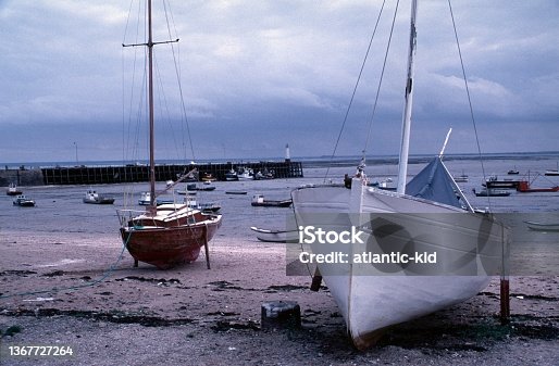 istock Beach with fishing boats at the port near Cancale 1367727264
