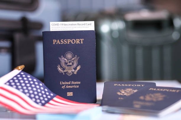 istock Travel: USA Passport, COVID-19 Vaccination Record Card, flag. 1367727480