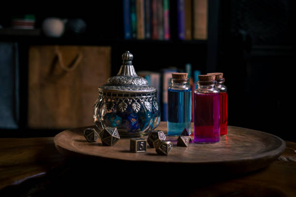 Magical potions and a glass pot with RPG dice stock photo