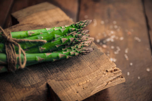istock fresh green sparrow grass bunch on an old wood cutting board 1367728819