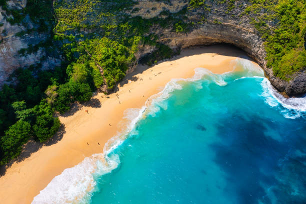 istock Waves and rocks as a background from top view. Blue water background from top view. Summer seascape from air. Bali island, Indonesia. Travel - image 1367731598