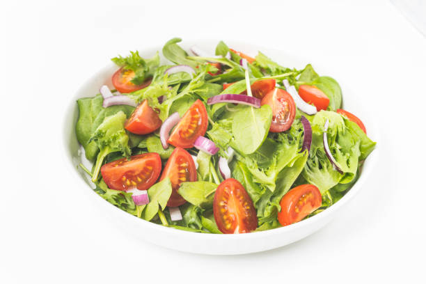 istock Summre green salad in white bowl plate on grey table 1367732654