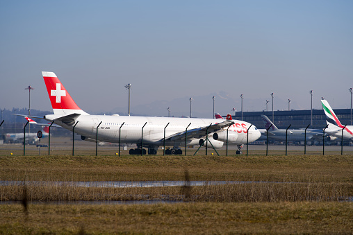 Swiss airplane Airbus A340-300 register HB-JMB taking off from runway 14 form Zürich Airport. Photo taken January 26th, 2022, Zurich, Switzerland.