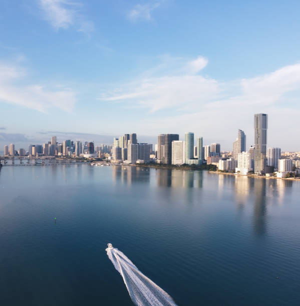 Boat across biscayne bay in miami florida at sunrise stock photo
