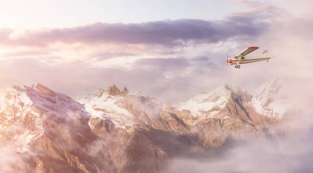 istock Single Engine Airplane Flying over the Rocky Mountain Landscape. 1367734821
