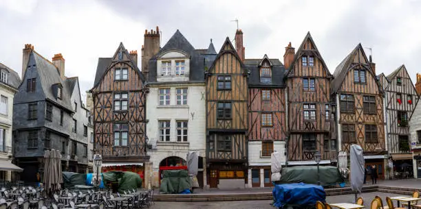 Photo of Panoramic view of Plumereau Square in Tours, France. Half-timbered houses dating back to the 15th century are an architectural decoration of famous touristic location.