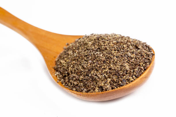 istock Black pepper powder on a white background 1367737627