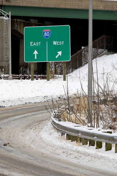 istock Interstate 80 East, West, road signs, snowy day 1367737775
