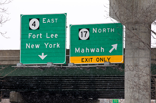 Road signs in winter to major highways in New Jersey and beyond.