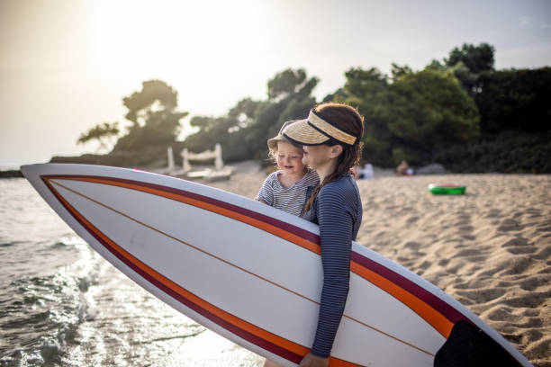 istock Surf mother with a baby boy at the beach 1367737829