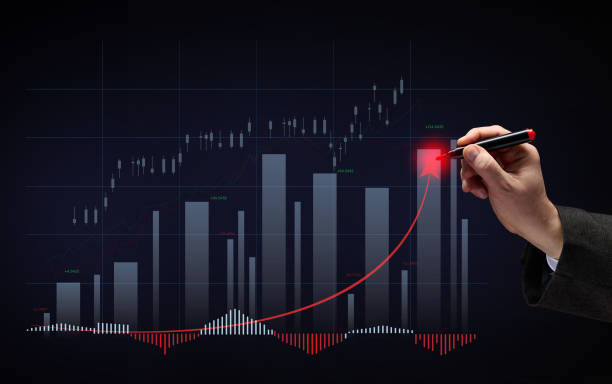 istock Holographic graph with growing indicators and a man's hand with a marker. Profitable business dynamics, high margin. Growth of indicators on the stock exchange 1367738586