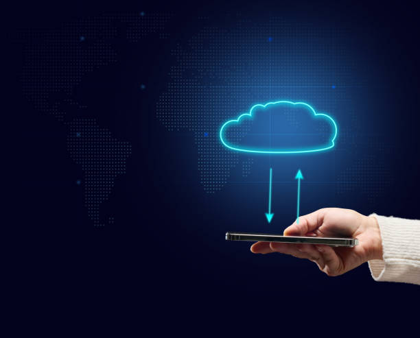 istock female hand holding mobile phone and virtual cloud. Sharing information, backing up, downloading and updating applications 1367738607