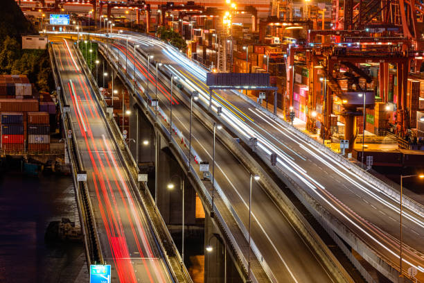 istock Cargo terminal traffic in city at night 1367739690