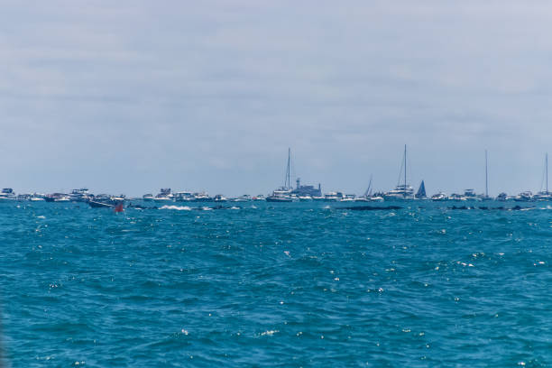 Chicago, IL | USA - 8-22-2021: Boats line up on Lake Michigan in Chicago for the Air and Water Show Chicago, IL | USA - 8-22-2021: Boats line up on Lake Michigan in Chicago for the Air and Water Show chicago smog stock pictures, royalty-free photos & images