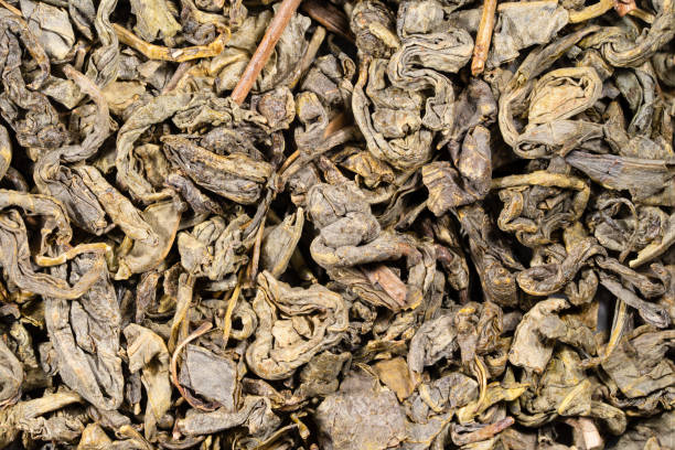 istock set of various dried green tea herbs seen from above. 1367741414