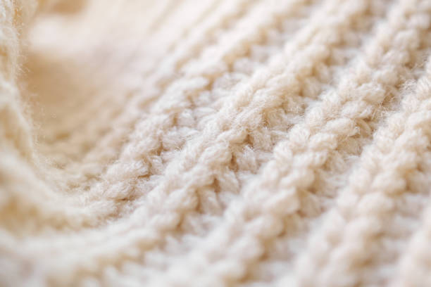 istock closeup beige knitted woolen fabric texture background 1367742494
