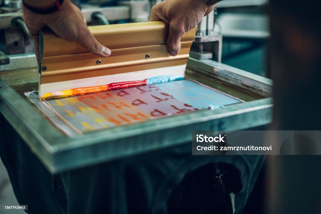 Pring Work Image Male Worker Pressing Ink On Frame While Using The Printing Machine In A ...