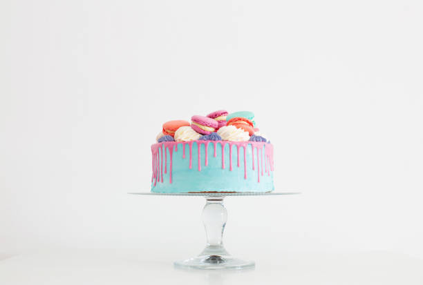 istock piece of cake with pink and blue decor on white background 1367742833