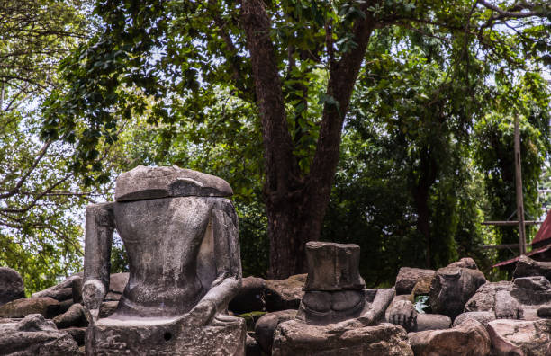 istock Ancient old buddha statue sculpture is damaged at the old temple in Ayuthaya. 1367743863