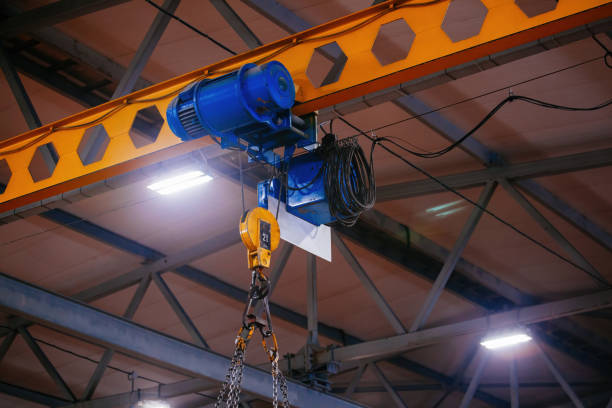 istock Overhead crane in the industrial building, close up 1367744100